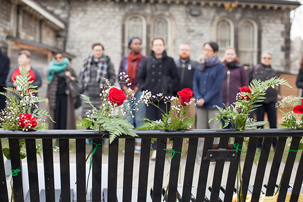 Members of the U of T community gather to mark the National Day of Remembrancae and Action on Violence Against Women