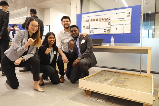 Fourth-year students Flavia Ng (CivE), Sayuri Guruge (MSE), Tayyeb Zarabi (MechE) and Jonathan Jeyarajah (MechE) designed a flooring solution to reduce exposure to contaminated soil found in the households of Indigenous communities in Guatamala. (Photo credit: Liz Do)