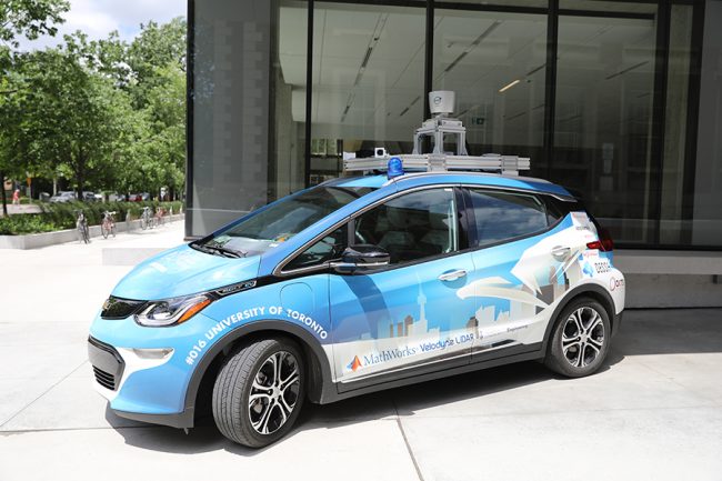 Zeus, a self-driving car. The car has a blue and white paint job.