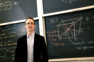 Image of Professor Scott Ramsay at a chalk board