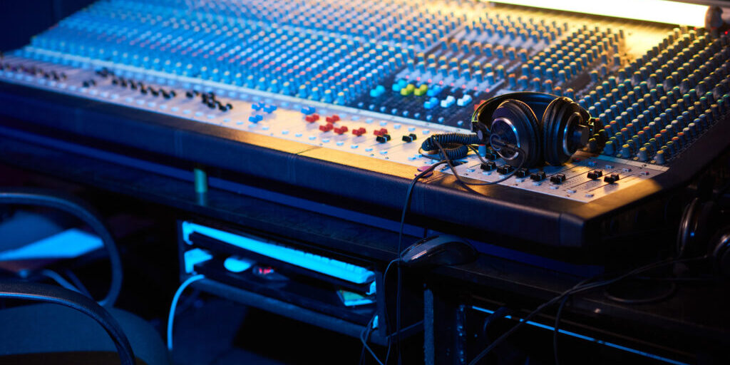 Close-up of workplace of producer with music keyboard to write songs